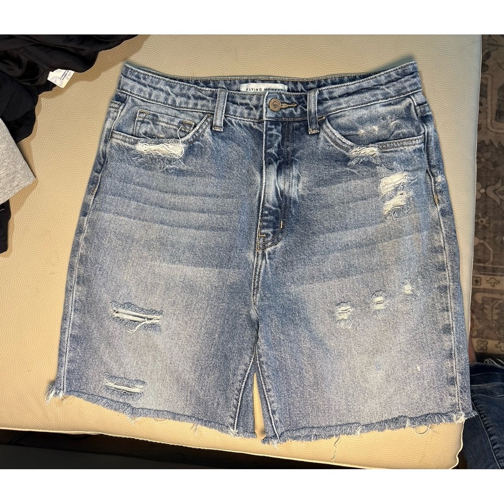 Women's size 29 Flying Monkey Distressed Denim Shorts with Frayed Hem.